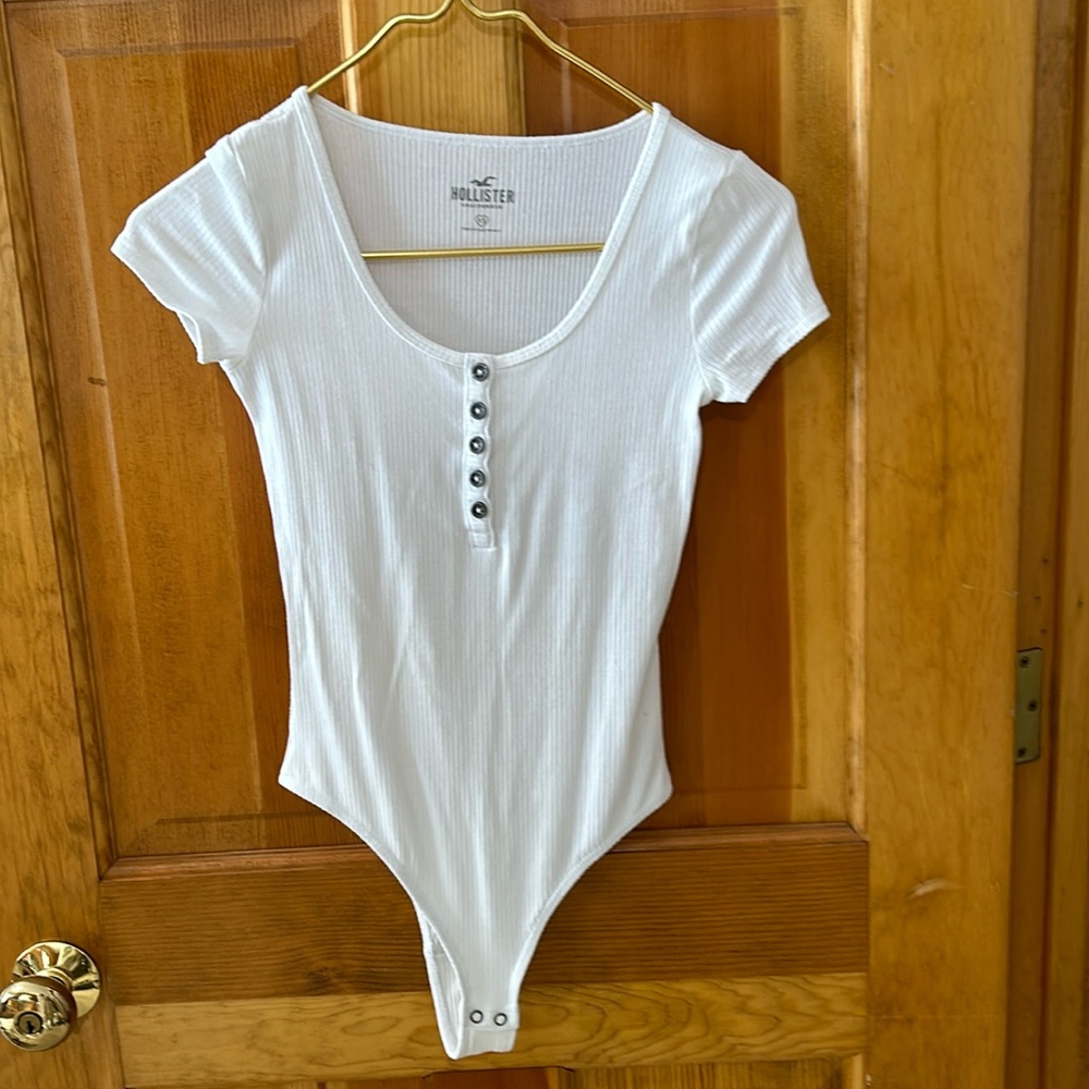 Hollister white short sleeve body suit. Size XS.